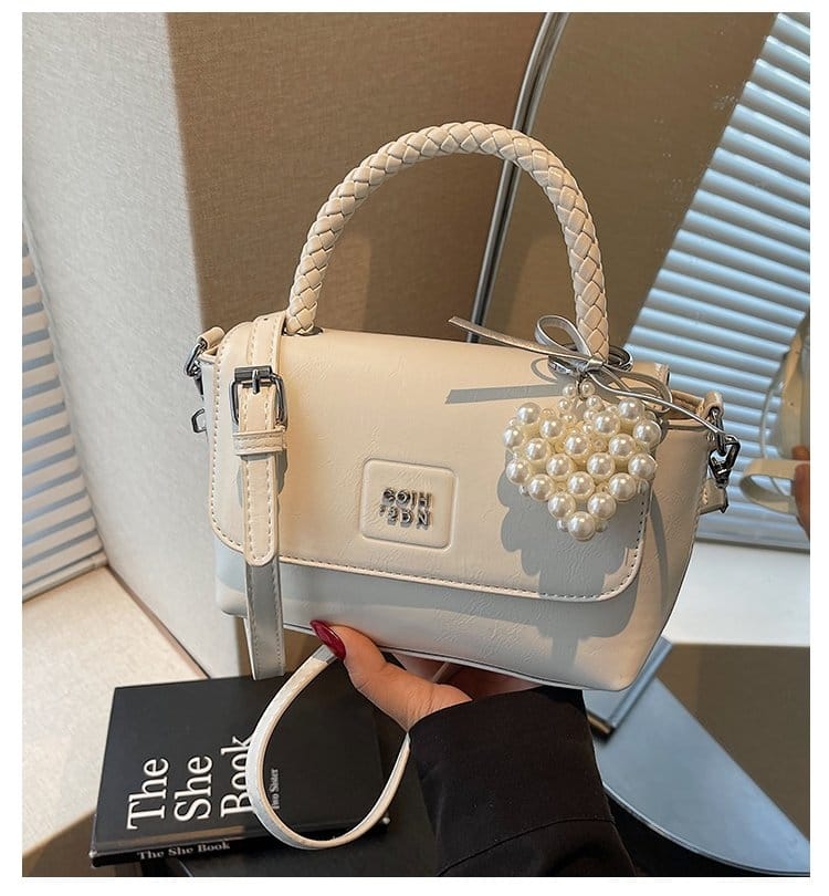 Solid color hand-held small square for women 2025 new model, niche commuting versatile, fashionable and western-style single shoulder crossbody bag