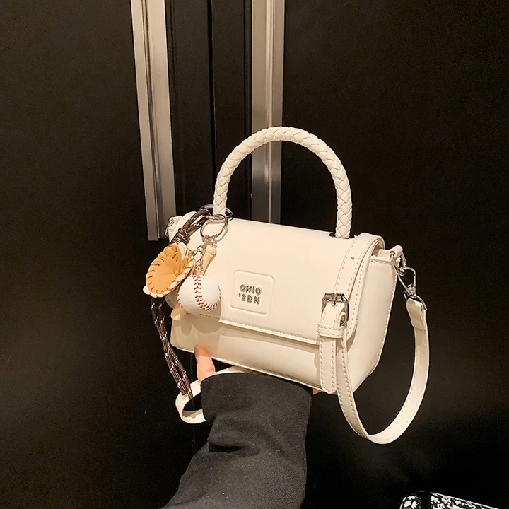 Solid color hand-held small square for women 2025 new model, niche commuting versatile, fashionable and western-style single shoulder crossbody bag